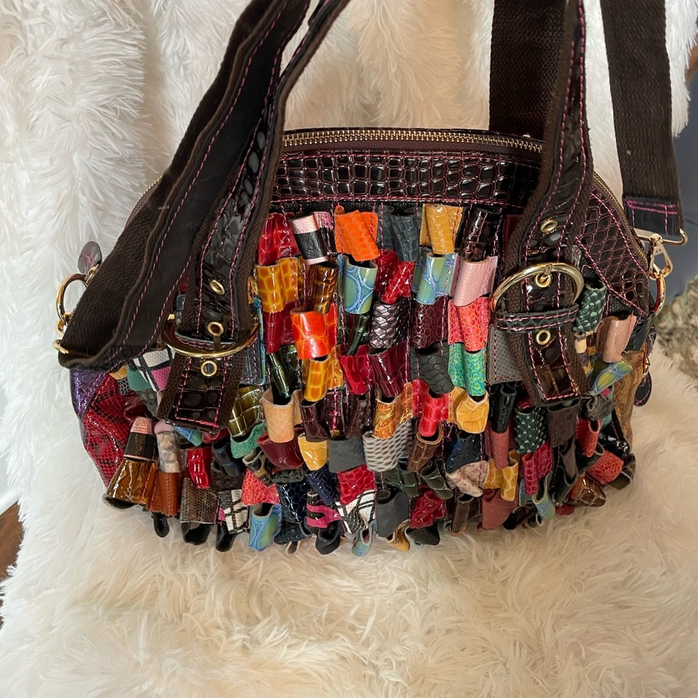 Multi color handbag with various looped leather strips. Colorful and fun.